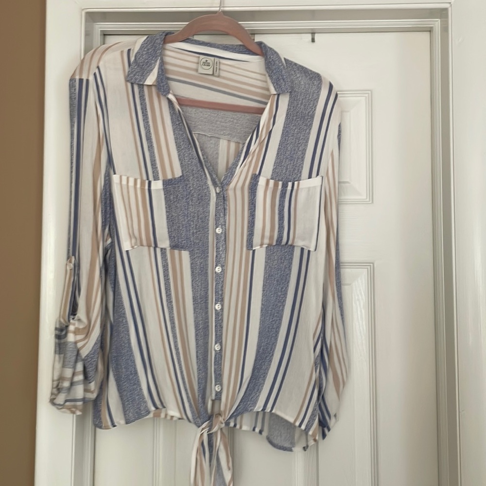 Paper crane button down and ties on the bottom of the shirt.